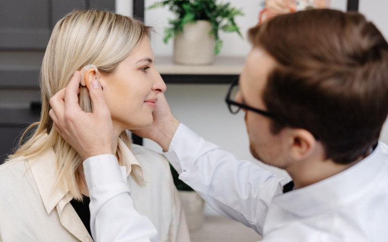 young-attractive-otolaryngologist-doctor-gives-consultation