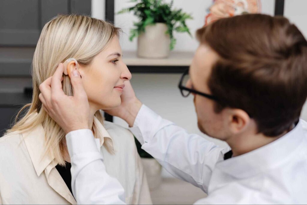 young attractive otolaryngologist doctor gives consultation