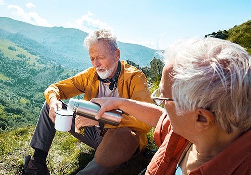 Senior couple hiking in the mountains together