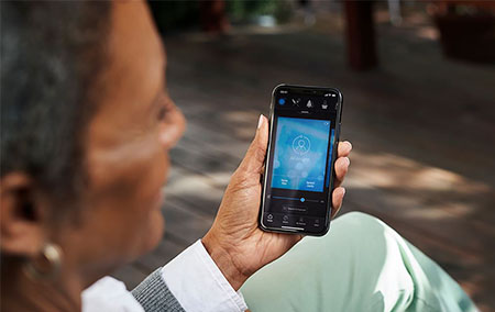 Beltone HearMax app visible on iPhone