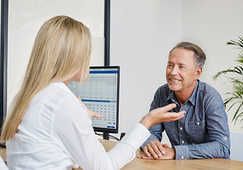Man speaking with a doctor during a hearing care consultation